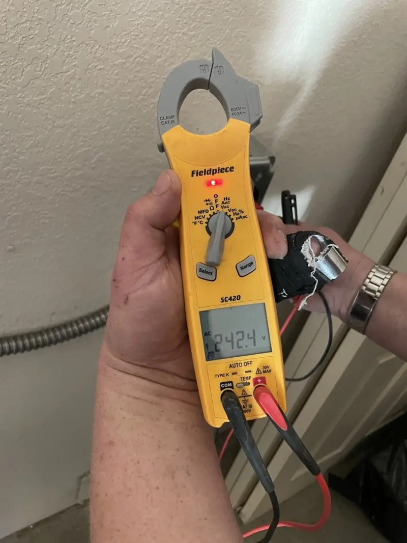 Voltage testing with clamp meter during Generator Installation in Marion